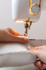 Image showing Sewing machine with seamstress closeup