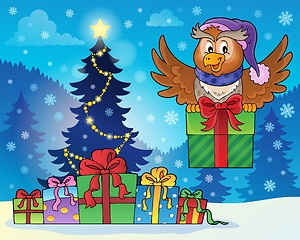 Image showing Owl with gift near Christmas tree