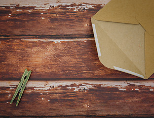 Image showing Vintage envelope with pin on wood