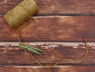 Image showing Rough thread reel with pin on wood