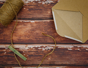 Image showing Vintage envelope with pin on wood