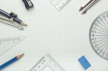 Image showing Mathematical instruments on graph paper