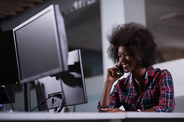 Image showing young black woman at her workplace in modern office