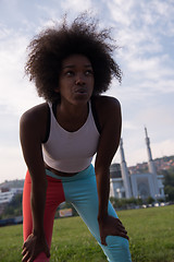 Image showing Portrait of sporty young african american woman running outdoors