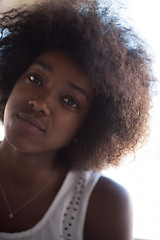 Image showing a young African American woman eating pasta