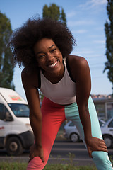 Image showing Portrait of sporty young african american woman running outdoors