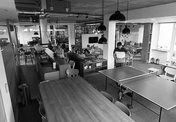 Image showing playing ping pong tennis at creative office space