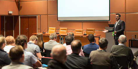 Image showing Business speaker giving a talk in conference hall.