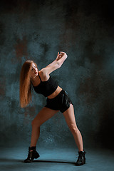 Image showing Attractive girl dancing twerk in the studio