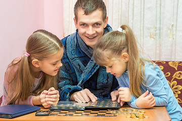 Image showing Pope shows the children collection of coins and smiling looked into the frame