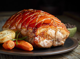 Image showing roasted pork on dark plate