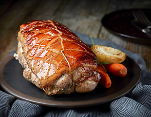 Image showing roasted pork on wooden table