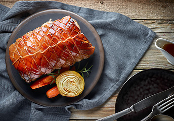 Image showing roasted pork on wooden table