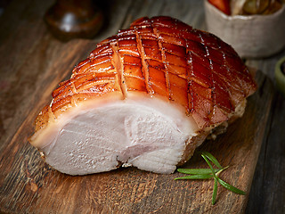 Image showing roasted pork on wooden table