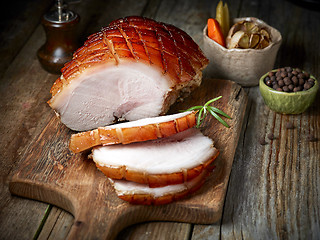 Image showing roasted pork on wooden table