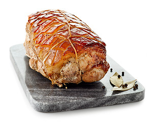 Image showing roasted pork on gray cutting board