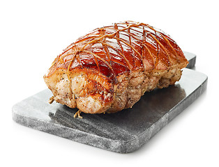 Image showing roasted pork on gray cutting board