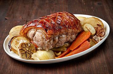 Image showing plate of roasted pork and vegetables