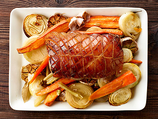 Image showing plate of roasted pork and vegetables