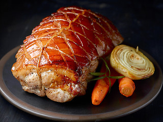 Image showing roasted pork on dark plate