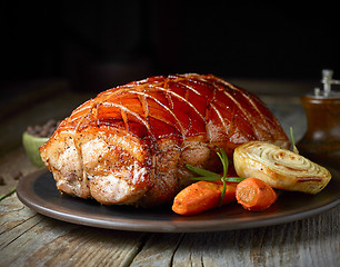 Image showing roasted pork on dark plate