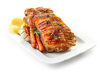 Image showing roasted pork and vegetables on white plate