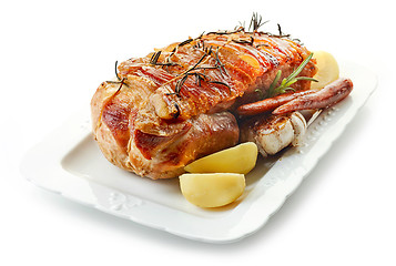 Image showing roasted pork and vegetables on white plate