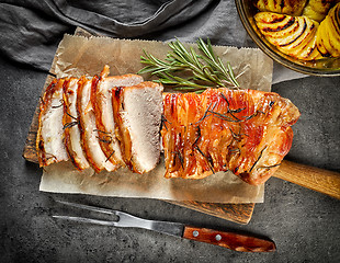 Image showing roasted pork on dark gray table