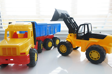 Image showing Toy Wheel Loader and Toy Dump Truck