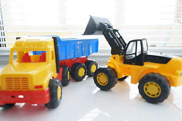 Image showing Toy Wheel Loader and Toy Dump Truck