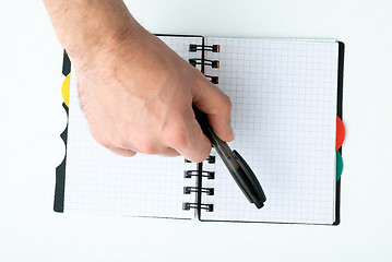 Image showing Hand writing on empty notepad