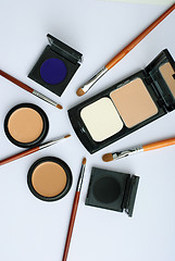 Image showing makeup brush and cosmetics, on a white background