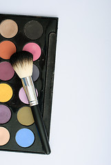 Image showing makeup brush and cosmetics, on a white background