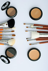 Image showing makeup brush and cosmetics, on a white background