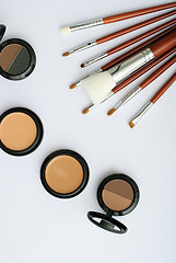 Image showing makeup brush and cosmetics, on a white background