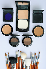 Image showing makeup brush and cosmetics, on a white background