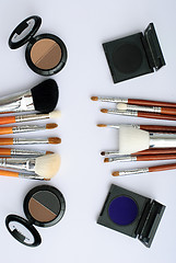 Image showing makeup brush and cosmetics, on a white background