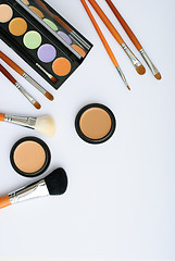 Image showing makeup brush and cosmetics, on a white background