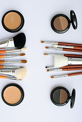 Image showing makeup brush and cosmetics, on a white background