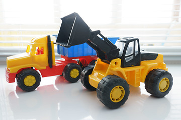 Image showing Toy Wheel Loader and Toy Dump Truck