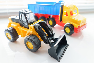 Image showing Toy Wheel Loader and Toy Dump Truck