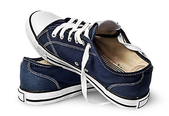 Image showing One pair of dark blue sports shoes on one another