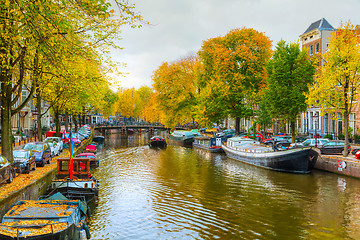 Image showing Amsterdam city view with canals and bridges