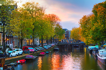 Image showing Amsterdam city view with canals and bridges