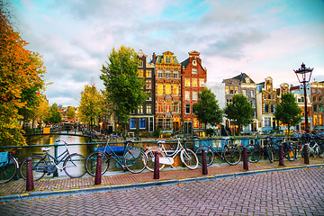 Image showing Amsterdam city view with canals and bridges