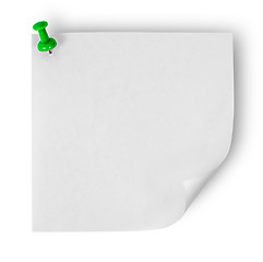 Image showing White sticker with the wrapped up corner pinned green office pin