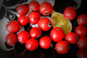 Image showing Hawthorn berries on a plate .