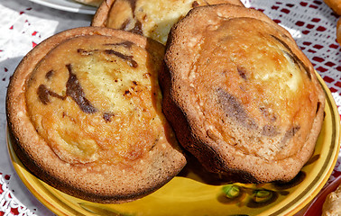 Image showing Two delicious cupcakes on a ceramic dish