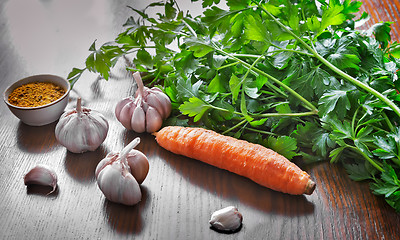 Image showing Parsley leaves , carrots , garlic and spices.