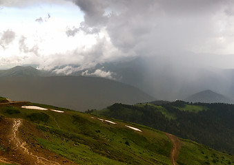 Image showing The mountainous landscape of the slopes covered by forest.